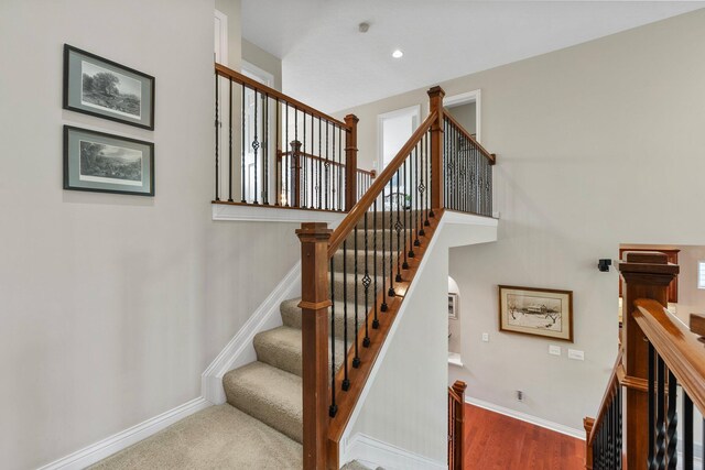6674 Letterman Dr, Powell, OH 43065 - stairway featuring baseboards, healthy amount of natural light, arched walkways, and recessed lighting
