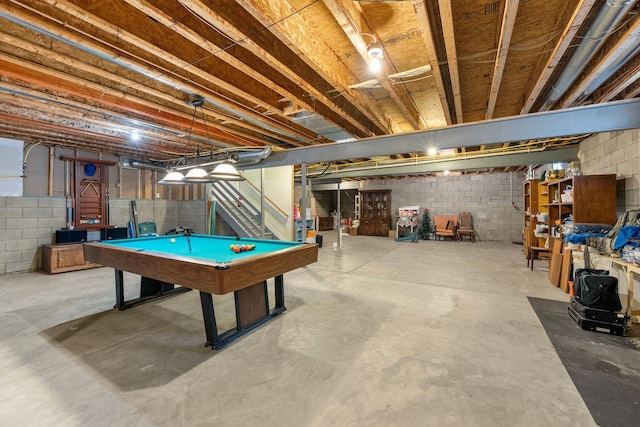 6674 Letterman Dr, Powell, OH 43065 - game room featuring billiards table, concrete block wall, and concrete flooring
