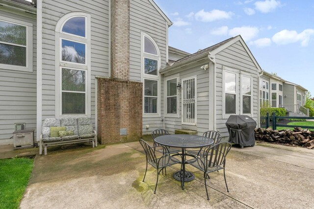 6674 Letterman Dr, Powell, OH 43065 - view of patio with a grill, fence, and outdoor dining area