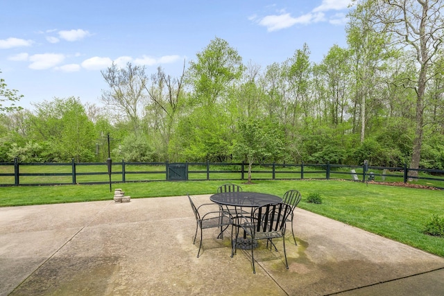 6674 Letterman Dr, Powell, OH 43065 - view of patio featuring outdoor dining space and view of wooded area