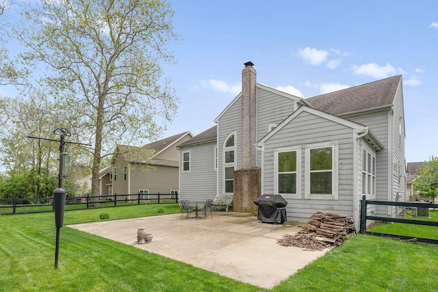 6674 Letterman Dr, Powell, OH 43065 - rear view of house with a patio and a chimney