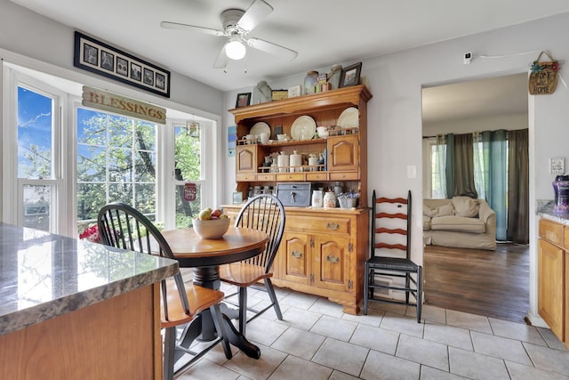 1525 Krebs Dr, Newark, OH 43055 - dining space with plenty of natural light, ceiling fan, and light tile patterned floors