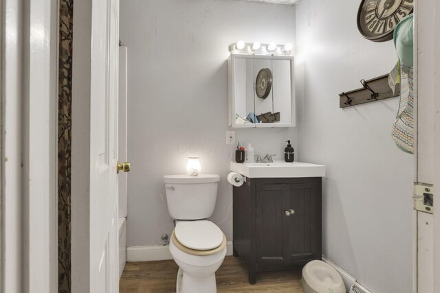 1525 Krebs Dr, Newark, OH 43055 - bathroom with wood finished floors, vanity, toilet, and baseboards