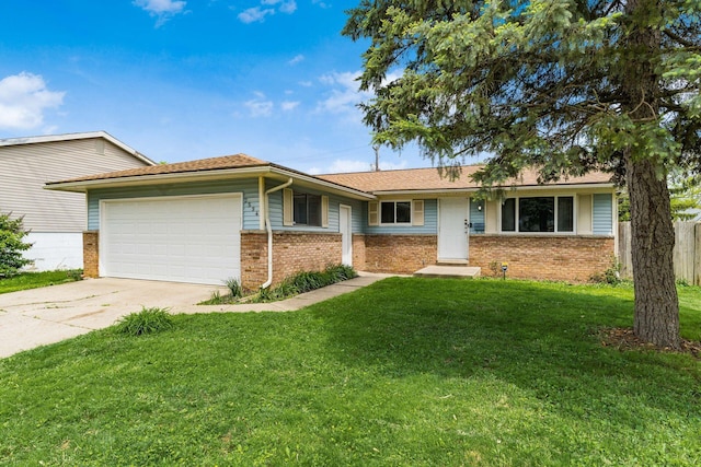 2594 Hubbell Rd, Columbus, OH 43232 - ranch-style house featuring brick siding, a garage, and driveway