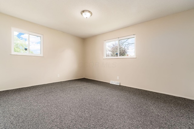 2594 Hubbell Rd, Columbus, OH 43232 - unfurnished room with dark colored carpet and baseboards