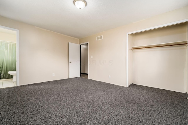 2594 Hubbell Rd, Columbus, OH 43232 - unfurnished bedroom with a closet, carpet, and connected bathroom