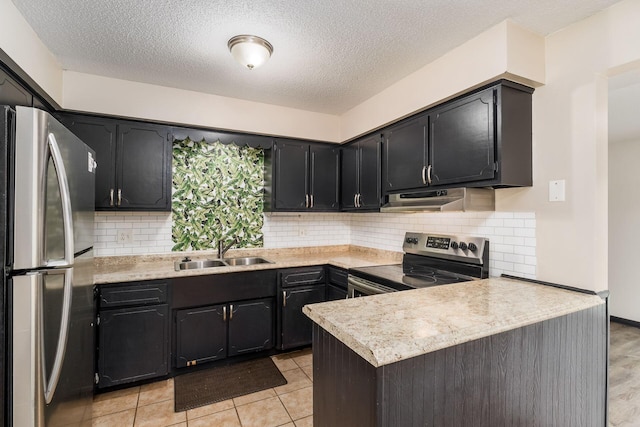2594 Hubbell Rd, Columbus, OH 43232 - kitchen featuring appliances with stainless steel finishes, a sink, a peninsula, under cabinet range hood, and light countertops