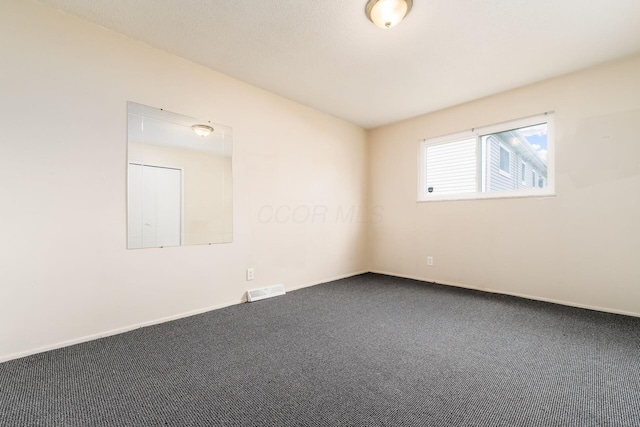 2594 Hubbell Rd, Columbus, OH 43232 - unfurnished room with dark colored carpet and baseboards