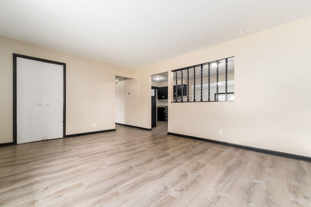 2594 Hubbell Rd, Columbus, OH 43232 - spare room with light wood-type flooring and baseboards