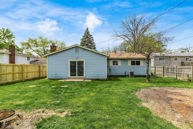 2594 Hubbell Rd, Columbus, OH 43232 - rear view of property with a chimney and central air condition unit