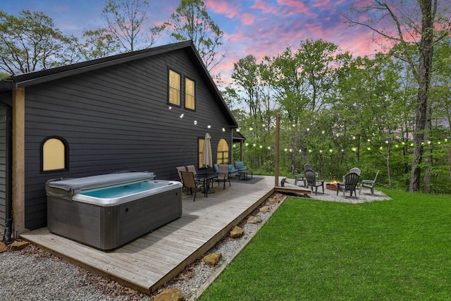 28306 Allison Rd, Mcarthur, OH 45651 - back of property with a hot tub, an outdoor fire pit, a yard, and a deck