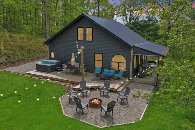28306 Allison Rd, Mcarthur, OH 45651 - rear view of house featuring a deck, a hot tub, a yard, and a patio