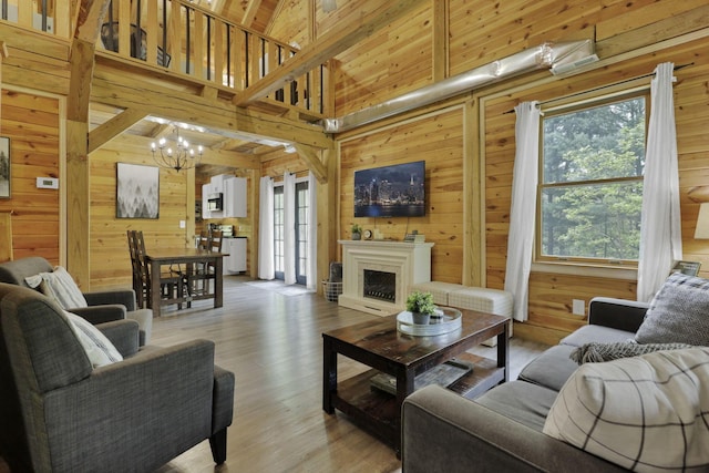 28306 Allison Rd, Mcarthur, OH 45651 - living room with wood walls, a chandelier, wood finished floors, and high vaulted ceiling