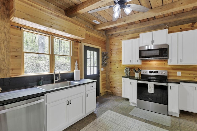 28306 Allison Rd, Mcarthur, OH 45651 - kitchen with appliances with stainless steel finishes, a sink, dark countertops, wooden ceiling, and healthy amount of natural light