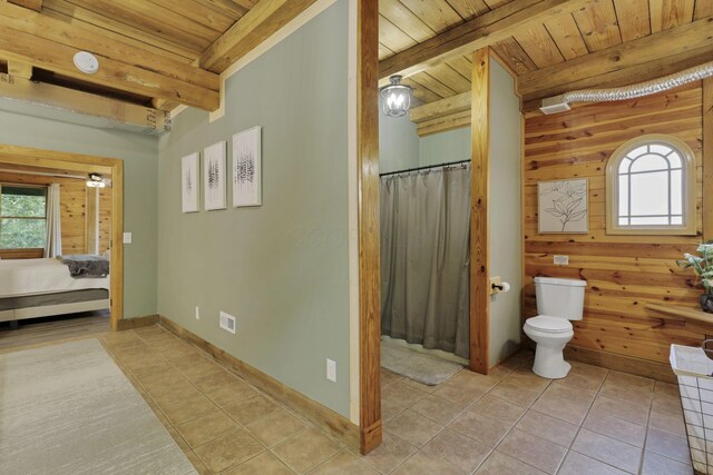 28306 Allison Rd, Mcarthur, OH 45651 - bathroom featuring wooden ceiling, beam ceiling, toilet, tile patterned floors, and connected bathroom