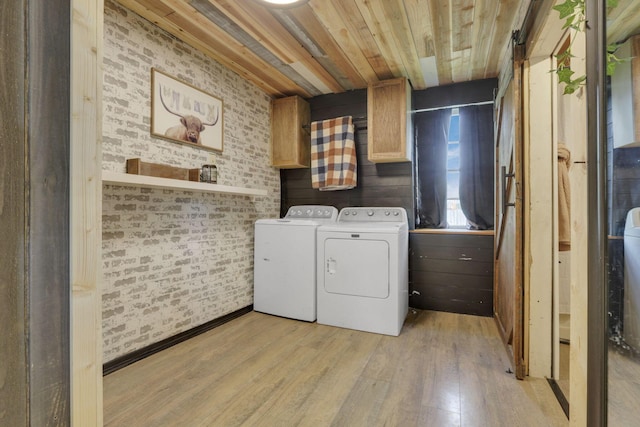 998 Wayne Ave, Zanesville, OH 43701 - laundry area with cabinet space, separate washer and dryer, light wood-style floors, wood ceiling, and brick wall