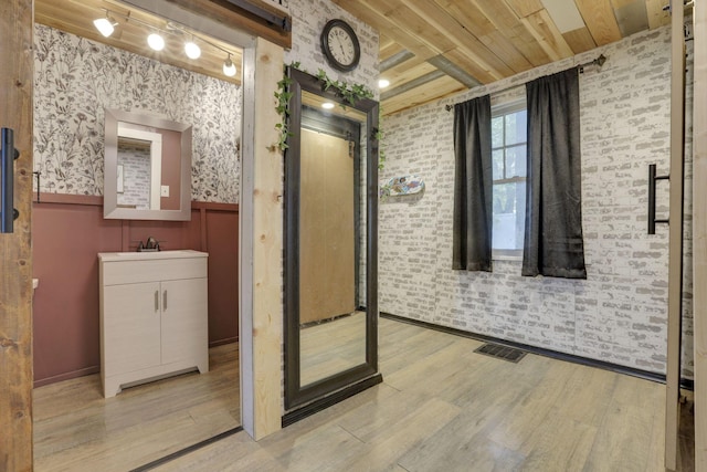998 Wayne Ave, Zanesville, OH 43701 - bathroom with wood ceiling, wood finished floors, a wainscoted wall, vanity, and wallpapered walls