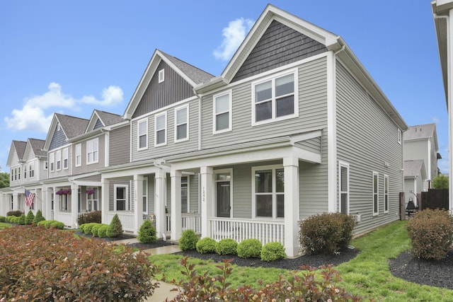 1242 N Grant Ave, Columbus, OH 43201 - view of property with a porch and board and batten siding