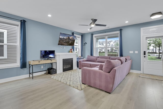 1242 N Grant Ave, Columbus, OH 43201 - living area with light wood-style flooring, ceiling fan, recessed lighting, baseboards, and a glass covered fireplace