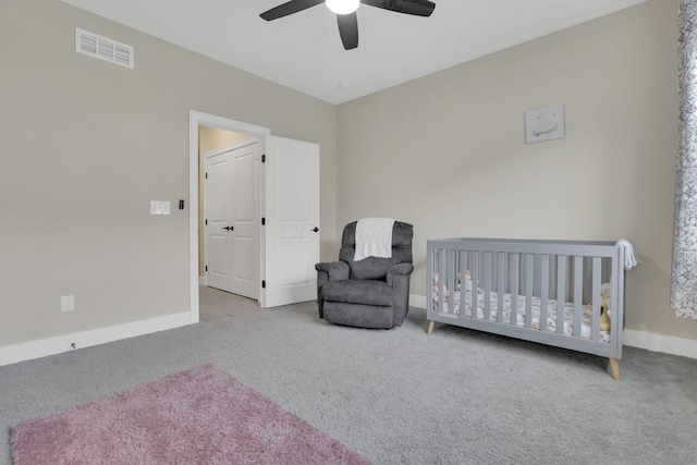 1242 N Grant Ave, Columbus, OH 43201 - bedroom featuring carpet floors, baseboards, a crib, and a ceiling fan