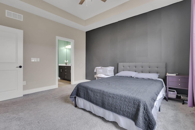 1242 N Grant Ave, Columbus, OH 43201 - carpeted bedroom with baseboards, connected bathroom, and a ceiling fan