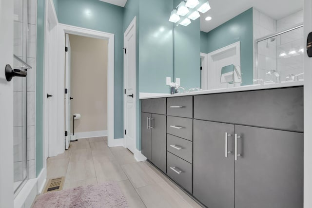 1242 N Grant Ave, Columbus, OH 43201 - full bath featuring a stall shower, vanity, and baseboards