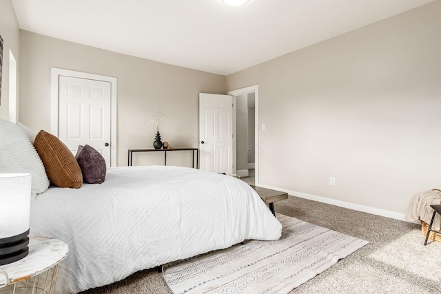 bedroom featuring carpet floors and baseboards