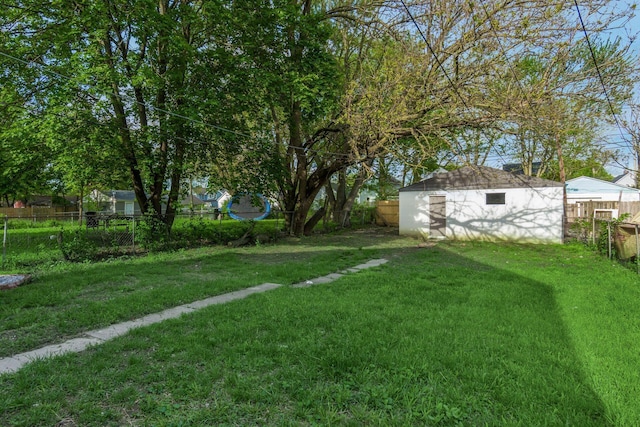 view of yard featuring an outbuilding and a storage unit
