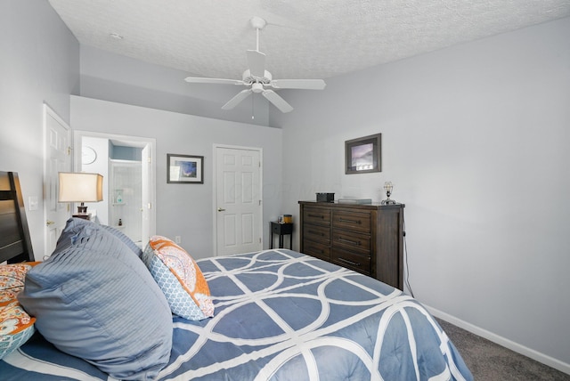 carpeted bedroom featuring baseboards, a textured ceiling, and a ceiling fan