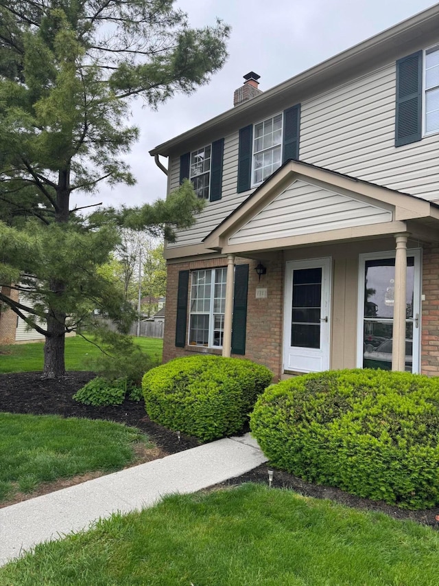 7782 Hansgrove Ct, Dublin, OH 43016 - view of front of home featuring a chimney and brick siding