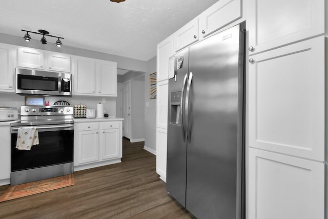 6528 Shenandoah Dr, Reynoldsburg, OH 43068 - kitchen with appliances with stainless steel finishes, dark wood finished floors, white cabinetry, light countertops, and a textured ceiling
