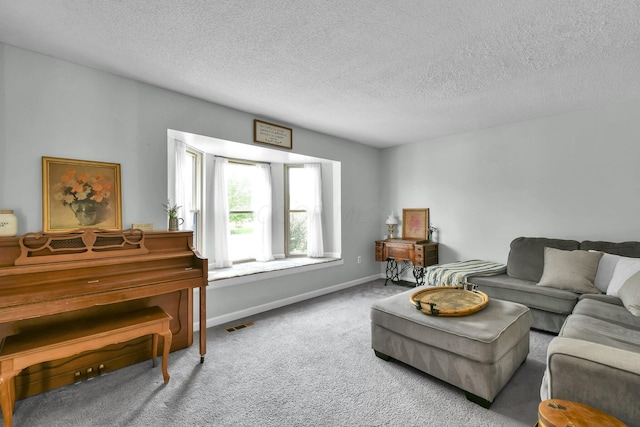 12164 Twincreek Dr, Pickerington, OH 43147 - living area with carpet, a textured ceiling, and baseboards