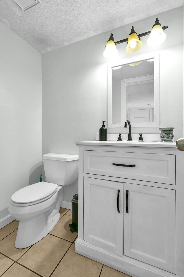12164 Twincreek Dr, Pickerington, OH 43147 - bathroom with toilet, vanity, tile patterned flooring, and a textured ceiling