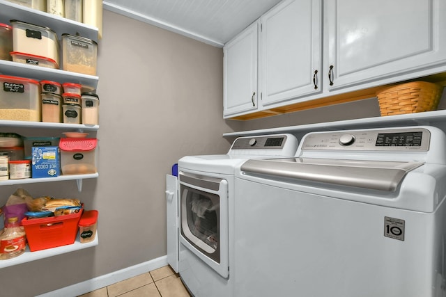 12164 Twincreek Dr, Pickerington, OH 43147 - clothes washing area featuring washing machine and dryer, light tile patterned floors, cabinet space, and baseboards