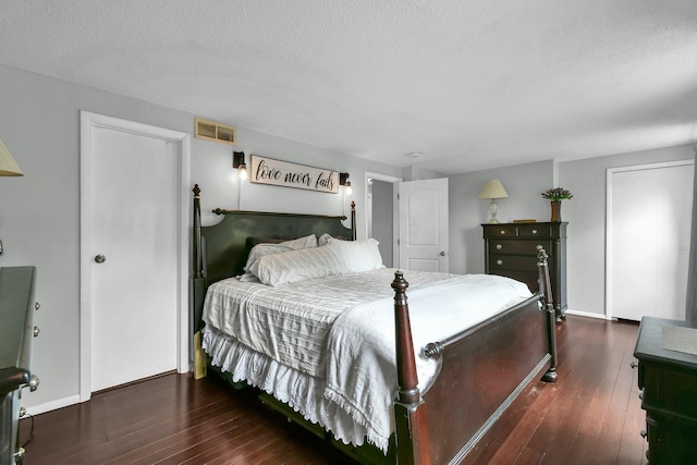12164 Twincreek Dr, Pickerington, OH 43147 - bedroom with hardwood / wood-style floors, a textured ceiling, and baseboards