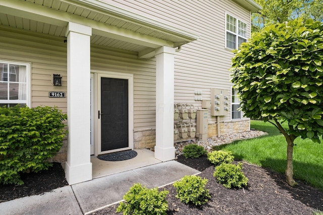 9162 Scenic View Cir, Columbus, OH 43240 - view of exterior entry with stone siding and a porch