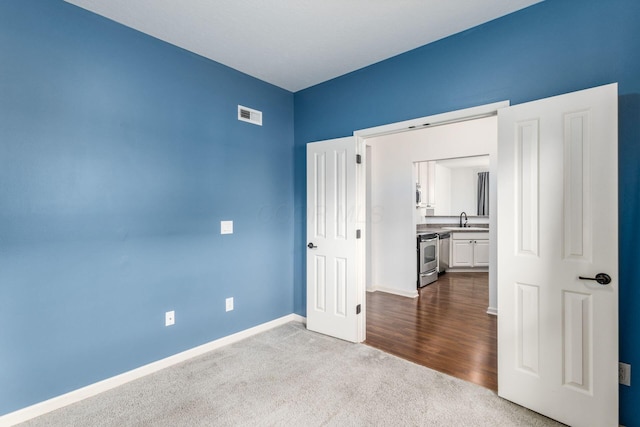 9162 Scenic View Cir, Columbus, OH 43240 - unfurnished bedroom with a sink, dark carpet, and baseboards