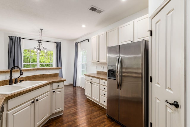 9162 Scenic View Cir, Columbus, OH 43240 - kitchen with stainless steel fridge, a sink, white cabinets, recessed lighting, and dark wood-style flooring