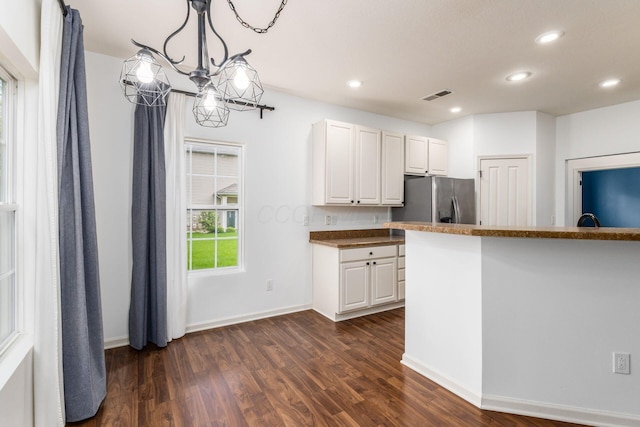 9162 Scenic View Cir, Columbus, OH 43240 - kitchen featuring dark wood-style flooring, white cabinets, recessed lighting, dark countertops, and baseboards