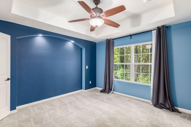 9162 Scenic View Cir, Columbus, OH 43240 - carpeted empty room with a tray ceiling, baseboards, and a ceiling fan