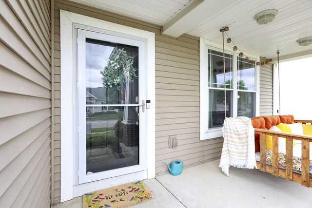 6843 John Dr, Canal Winchester, OH 43110 - view of exterior entry with a porch
