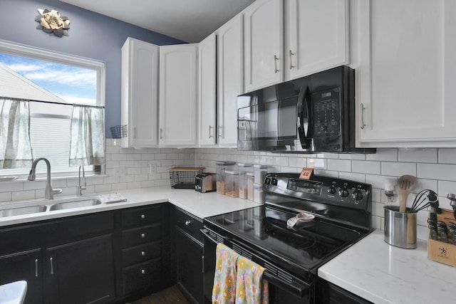 6843 John Dr, Canal Winchester, OH 43110 - kitchen featuring black appliances, a sink, and white cabinetry