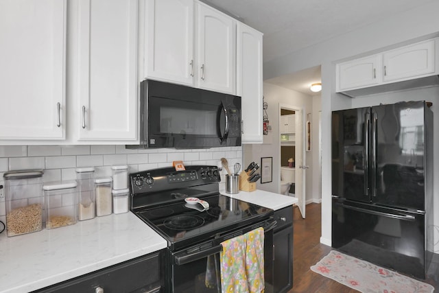 6843 John Dr, Canal Winchester, OH 43110 - kitchen with black appliances, white cabinets, and tasteful backsplash