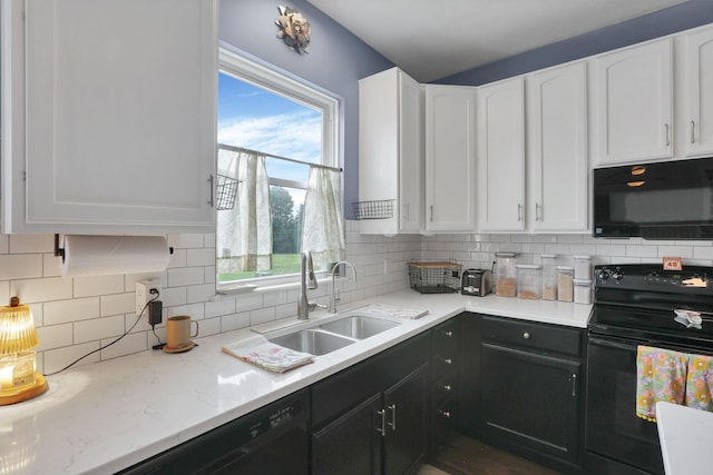6843 John Dr, Canal Winchester, OH 43110 - kitchen featuring black appliances, a sink, and white cabinets