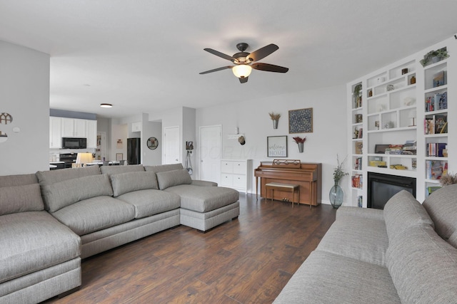 6843 John Dr, Canal Winchester, OH 43110 - living area with a ceiling fan, dark wood-style floors, and a glass covered fireplace
