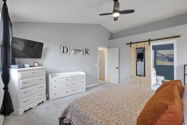 6843 John Dr, Canal Winchester, OH 43110 - bedroom featuring light carpet, vaulted ceiling, ensuite bathroom, a barn door, and baseboards