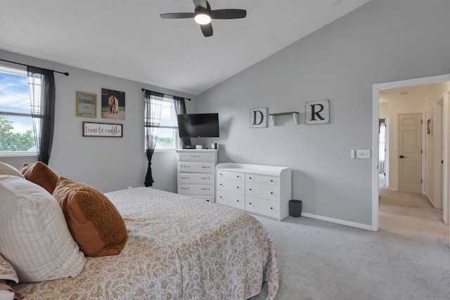 6843 John Dr, Canal Winchester, OH 43110 - bedroom featuring vaulted ceiling, light carpet, baseboards, and a ceiling fan