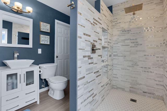 6843 John Dr, Canal Winchester, OH 43110 - full bath with a walk in shower, toilet, vanity, and wood finished floors