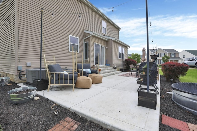 6843 John Dr, Canal Winchester, OH 43110 - rear view of property with a patio area and central AC unit