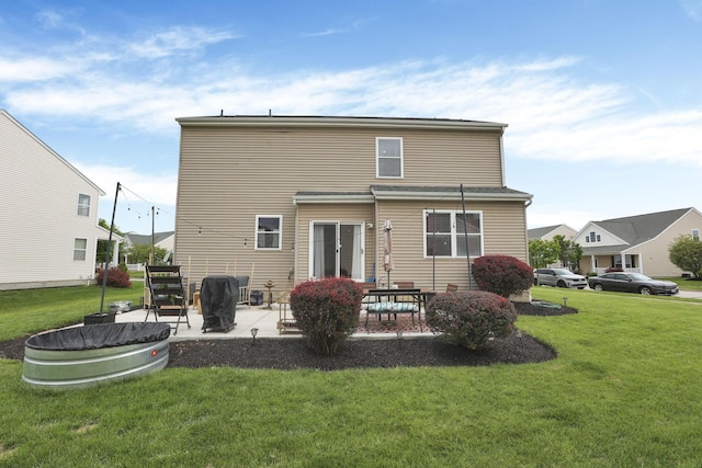 6843 John Dr, Canal Winchester, OH 43110 - rear view of property with a yard and a patio area